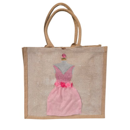 Hand-painted jute tote bag featuring a blush pink bridesmaid dress with floral details on a natural canvas background