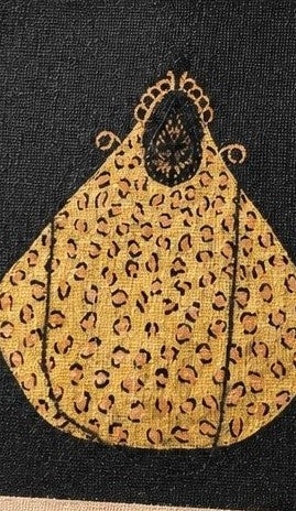 close up of Hand-painted black jute tote bag featuring a bold leopard-print purse design, blending playful fashion with statement-making style for everyday wear or gifting.
