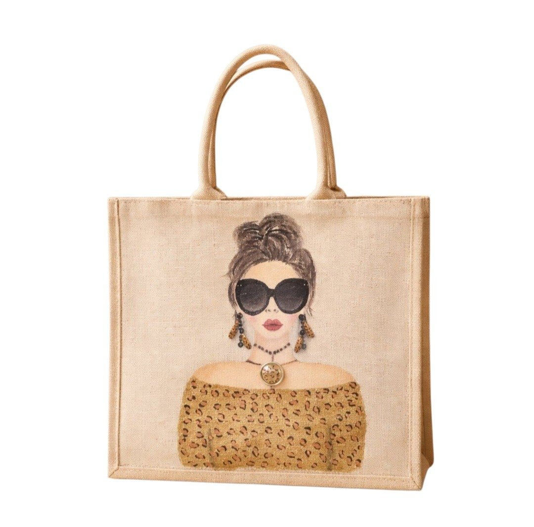 Hand-painted jute tote bag featuring a stylish woman with oversized black sunglasses, a leopard print off-the-shoulder top, statement earrings, and layered jewelry on a natural canvas background.