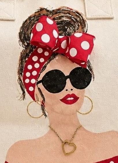 Close-up of Scarlet Muse with dimensional red polka dot bow, black sunglasses and gold jewelry details