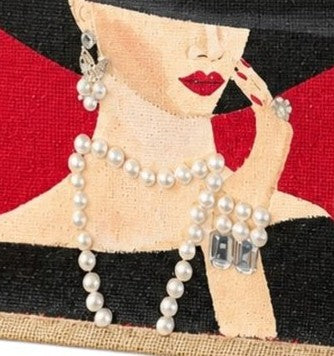 Hand-painted red jute tote bag featuring a sophisticated woman in a wide black hat with pearl jewelry and red lipstick, accented with dimensional embellishments on a bold red background.