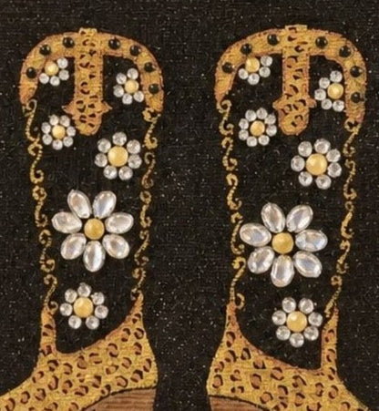 close up of Hand-painted black and gold cowboy boot tote bag with jeweled flowers on a black background