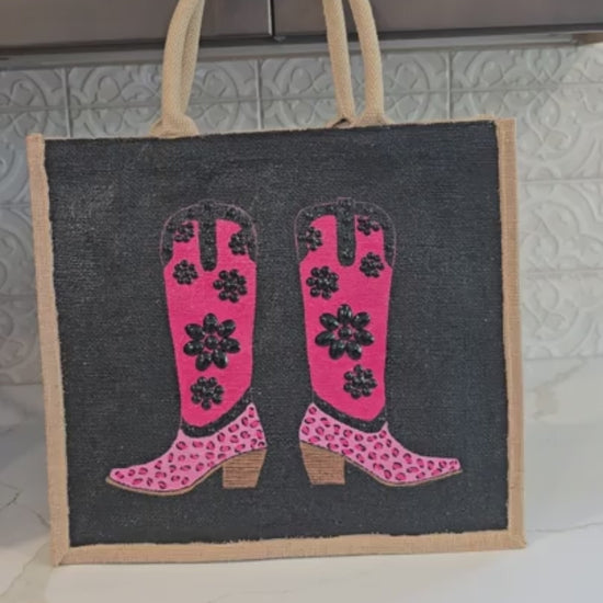 video of Hand-painted pink and black cowboy boot tote bag with black jeweled floral embellishments