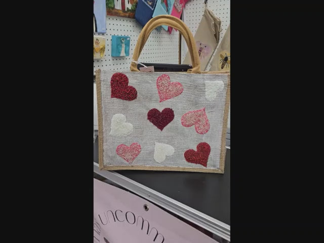 video of red pink white hearts tote bag, metallic off-white tote bag, beaded hearts jute bag, eco-friendly heart tote, valentines day tote