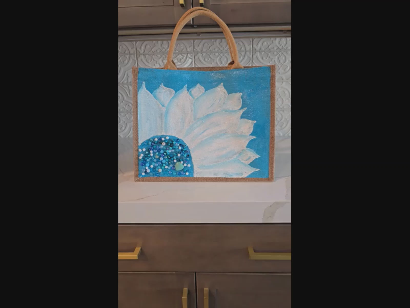 Video of turquoise sunflower tote bag, floral market tote, eco-friendly jute tote, hand painted sunflower bag