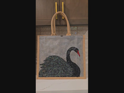 video of Hand painted and embellished black swan tote bag by Dana's Uncommon Glass