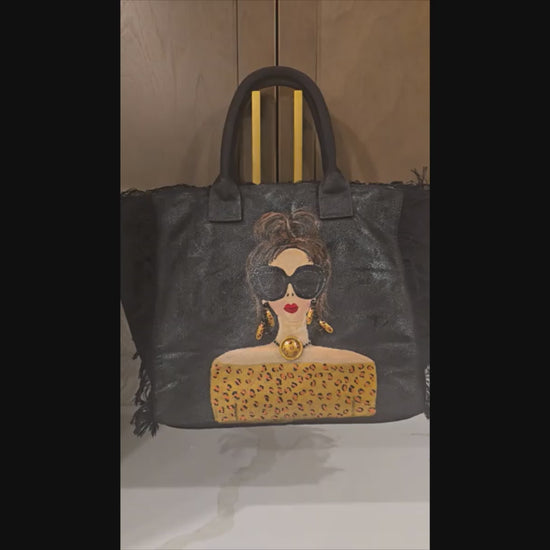 video of Hand-painted black fringed tote bag with glam sunglasses woman design and leopard print detail