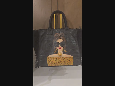 video of Hand-painted black fringed tote bag with glam sunglasses woman design and leopard print detail