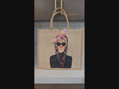 Video of Hand painted jute tote bag featuring a fashion portrait with sunglasses, pink bandana bow, and embellished statement jewelry