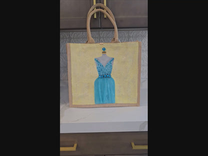 video of Hand-painted bridal tote bag featuring a white embellished wedding dress with textured floral skirt on a natural jute bag, perfect for bride gifts and wedding events.