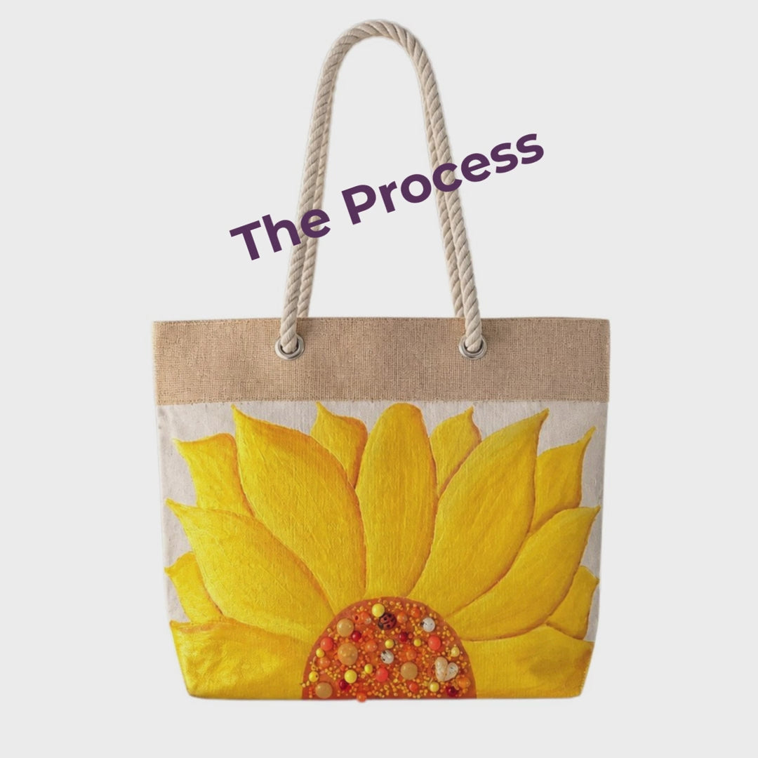 Short video showing the hand-painted creation process of a sunflower rope handle tote bag, including painting, embellishing, and resin finishing in Dana’s Las Vegas studio.