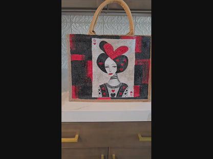 Black jute tote bag with hand-painted Queen of Hearts playing card design and decorative beading.n