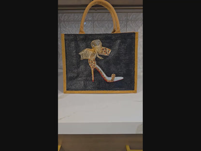 Black jute tote bag with hand-painted copper animal print stilettos and red soles, featuring beaded embellishments.