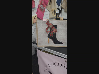Off white jute tote bag with hand-painted black booties and red soles, featuring beaded embellishments.