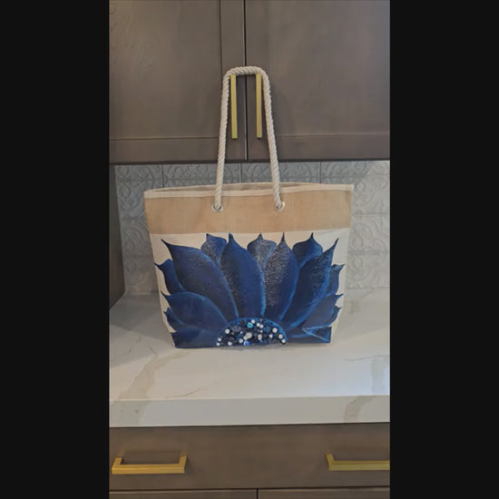 Hand-painted rope handle tote bag with a deep blue sunflower and bead embellishments.