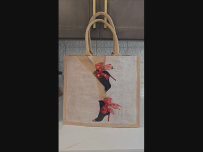 video of Kicking Up Her Heels Tote Bag, woman legs with black booties and red multicolored ribbon