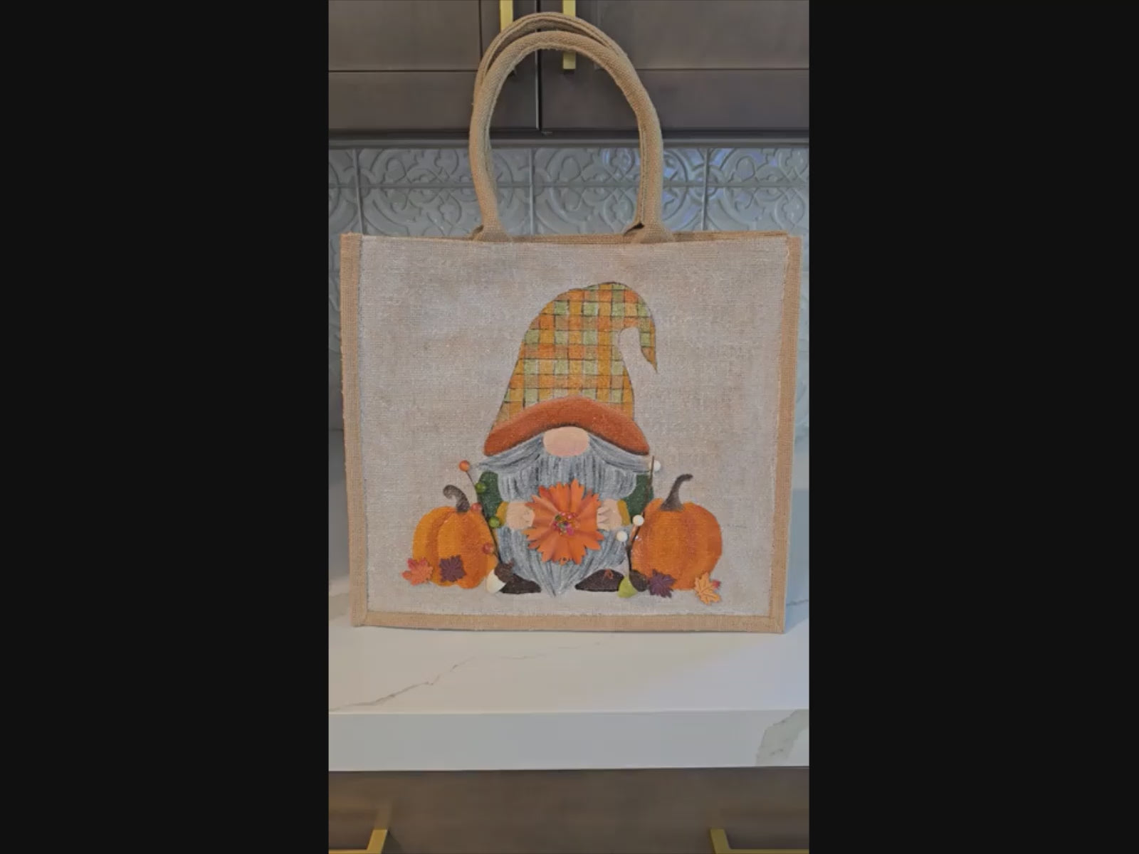 Hand-painted Fall Gnome tote bag with sunflowers, acorns, and berries on metallic jute background
