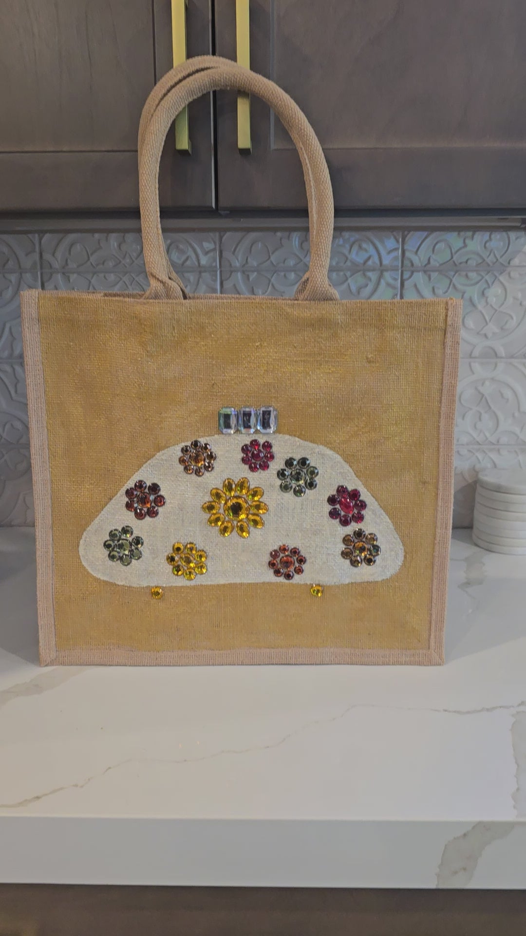Video of Hand Painted and Embellished Ivory Purse on Gold Jute Tote Bag Embellished with jewels.