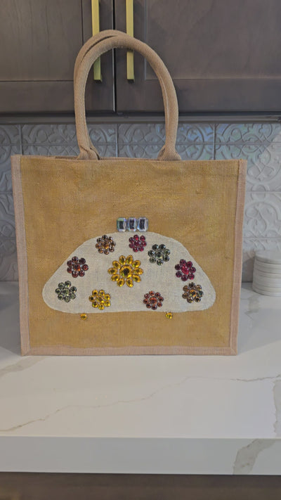 Video of Hand Painted and Embellished Ivory Purse on Gold Jute Tote Bag Embellished with jewels.