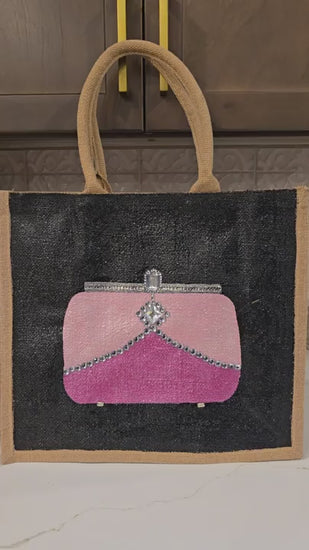 video of Pink jeweled purse design hand-painted on black jute tote bag
