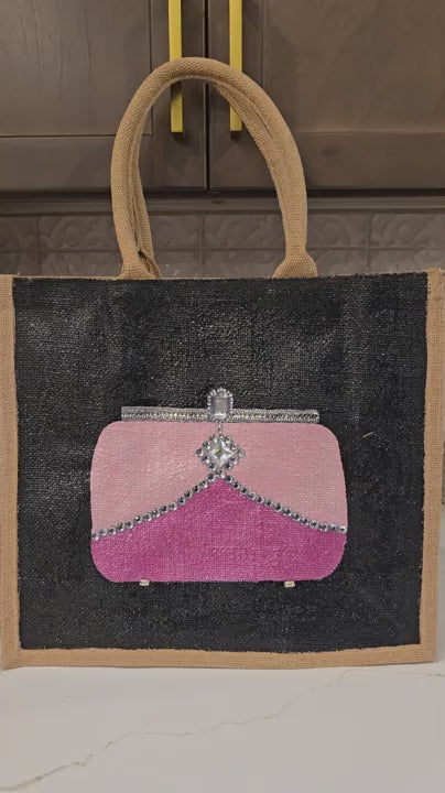 video of Pink jeweled purse design hand-painted on black jute tote bag