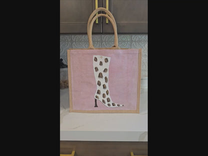 Cow Print Boot Tote Bag.  Brown, black and gold cow print on white boot set on metallic light pink background.