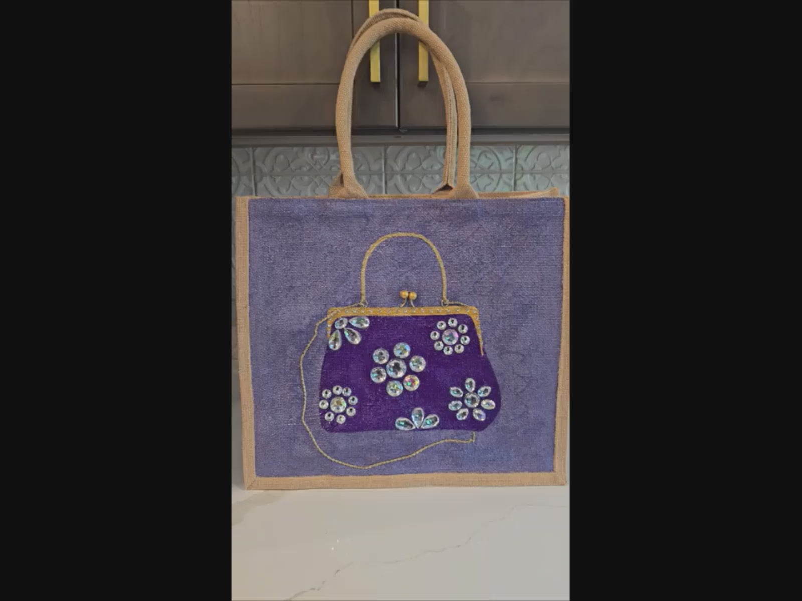 video of Hand-painted amethyst jewel purse tote on purple jute bag