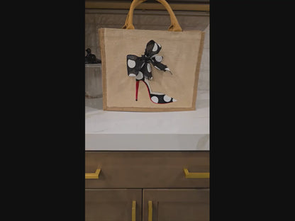 Off white jute tote bag with hand-painted black stilettos, white polka dots, red soles, and beaded accents.