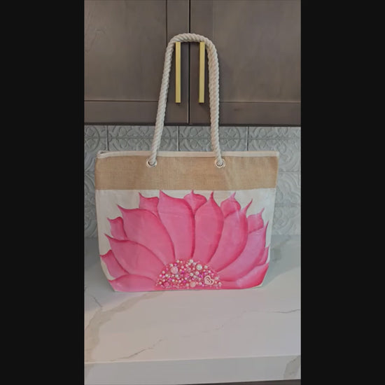 Hand-painted rope handle tote bag featuring a bright pink sunflower with bead embellishments.
