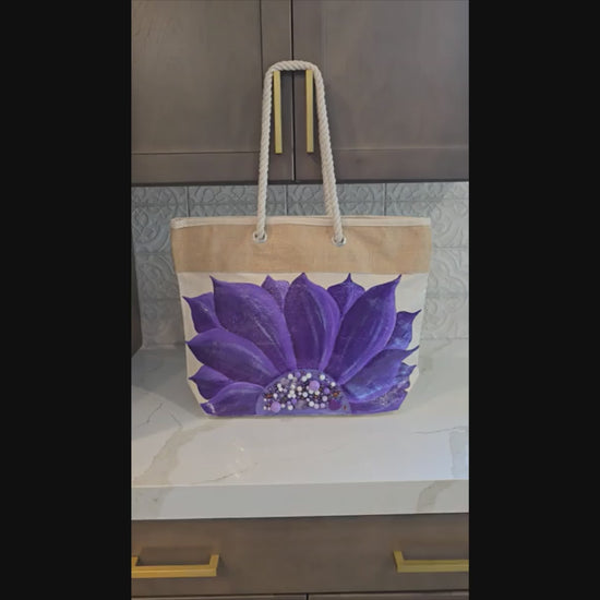 Hand-painted rope handle tote bag featuring a vibrant purple sunflower with bead embellishments.