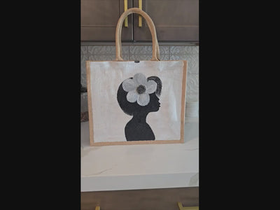 video of  Magnolia Muse hand painted tote bag by Danas Uncommon Glass