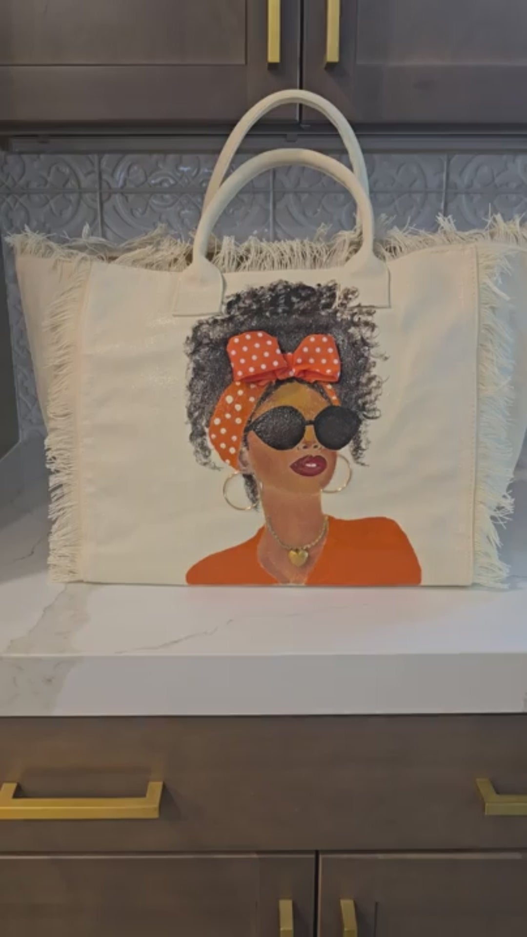 video showing details of orange polka dot muse hand-painted tote bag