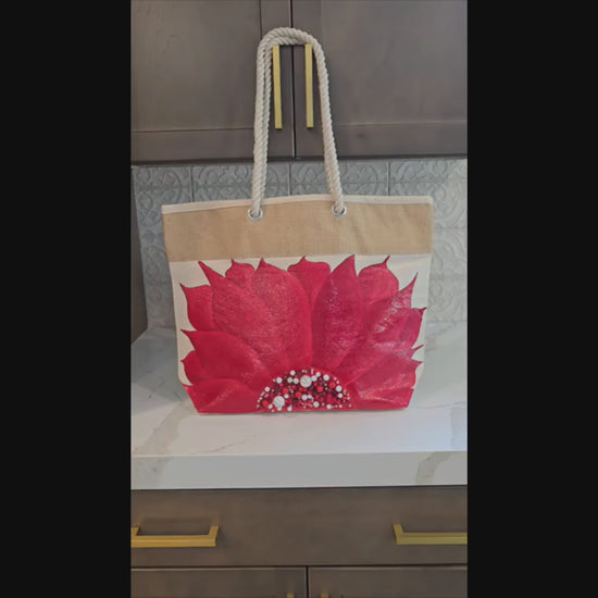 Hand-painted rope handle tote bag featuring a bold red sunflower with bead embellishments.