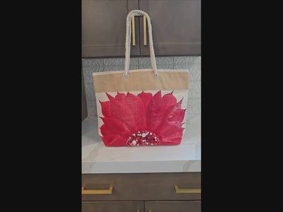 Video of Hand-painted rope handle tote bag featuring a bold red sunflower with bead embellishments.