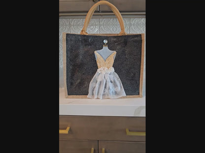 Black jute tote bag with hand-painted white wedding dress design and beaded embellishments.