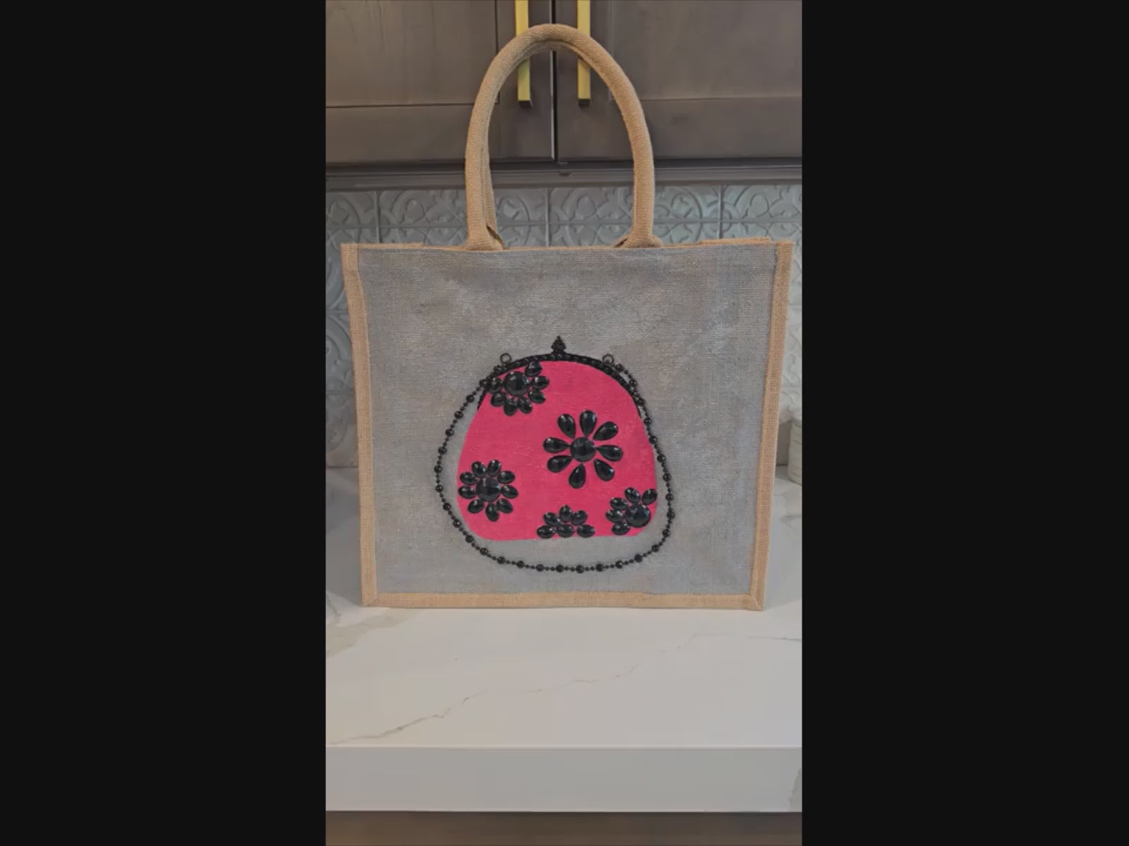 Video of vintage-inspired pink and black floral purse tote hand-painted on jute