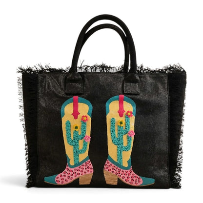 Desert Kicks hand-painted Western tote bag with colorful cowboy boots, blooming cacti, handcrafted embellishments, and black fringe.