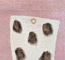 close up of Hand-painted pink jute tote bag featuring a white cow-print western boot design with black and brown spotted detailing, inspired by modern western fashion and wearable art styling.